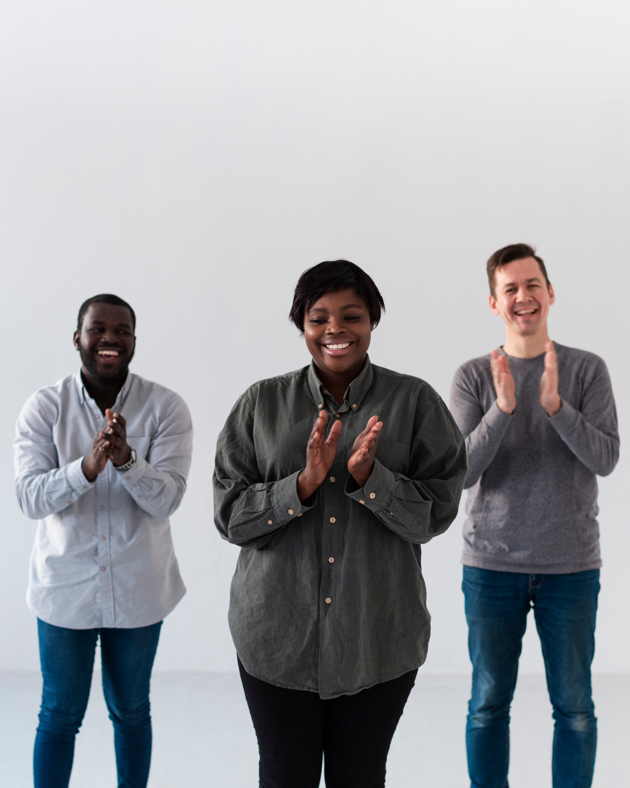 front view smiling patients applauding scaled